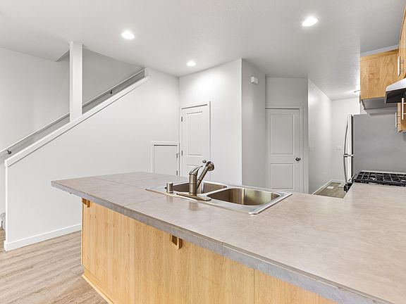 storage under stairs, 1/2 bath down, garage, plus pantry next to fridge