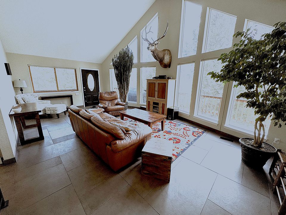 Large open living room with vaulted ceilings.