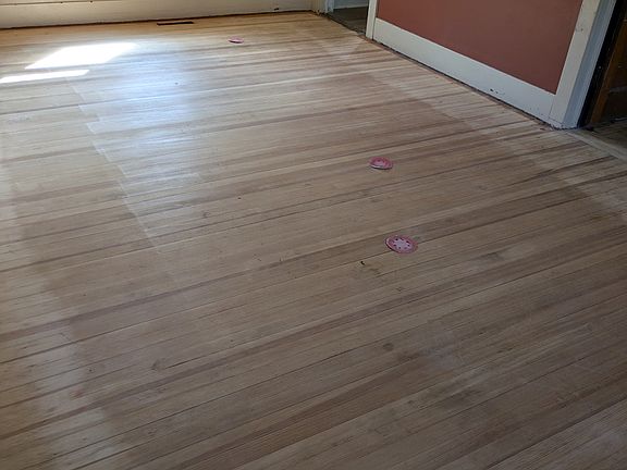 Living room after carpet was removed
