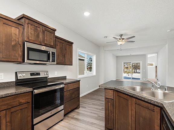 The kitchen is chef-ready with stainless steel appliances