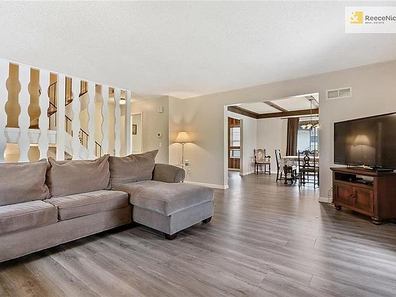 Living room leads to formal dining room and kitchen
