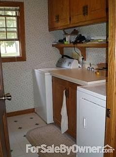 Handy 1st floor laundry; plenty of storage beneath sink. Washer/dryer stay!
