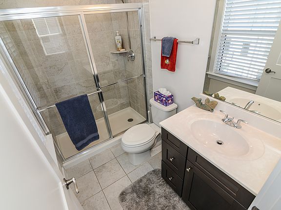 Upper level shower bath