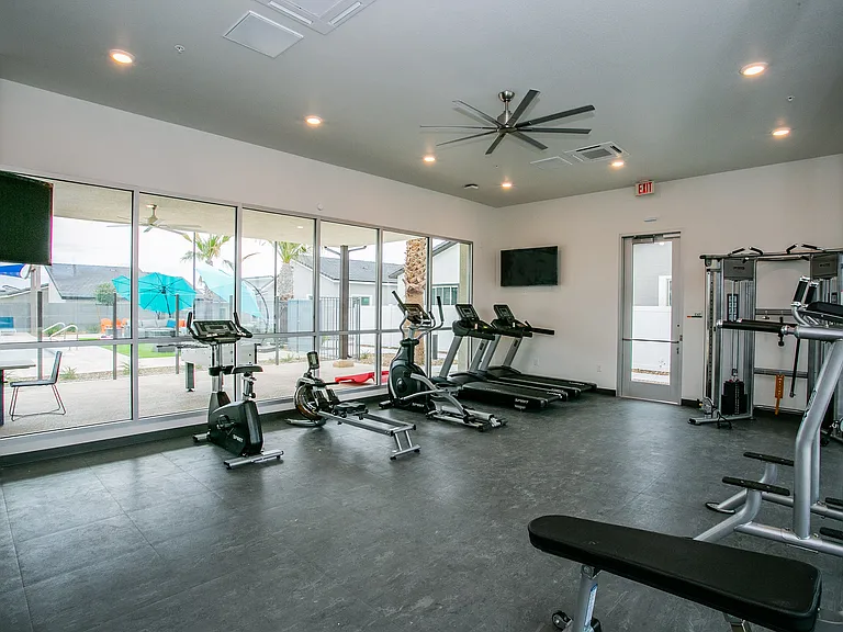 Elevate your workout routine in our state-of-the-art gym with scenic views.