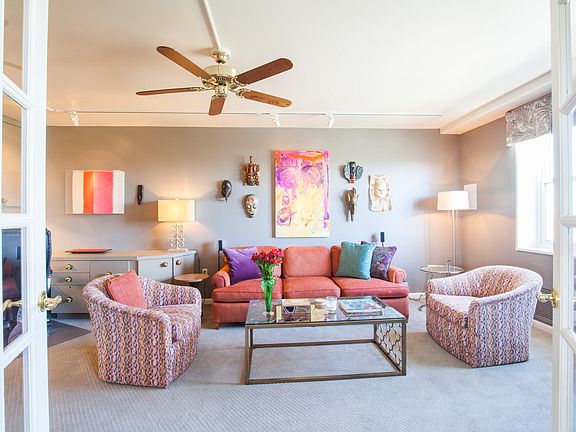 Additional seating in the den with a 65" 4K television and s