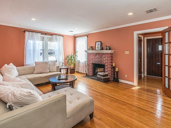 1st floor living room w/ wood fireplace