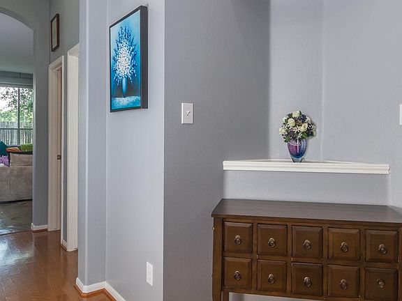 The foyer is large and has a pretty art niche.