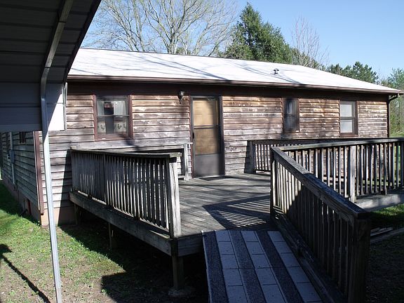 Back of house with deck