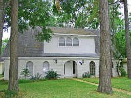 EXCEPTIONAL F I V E BEDROOM HOME NESTLED AMONG TALL TREES ON A QUIET STREET