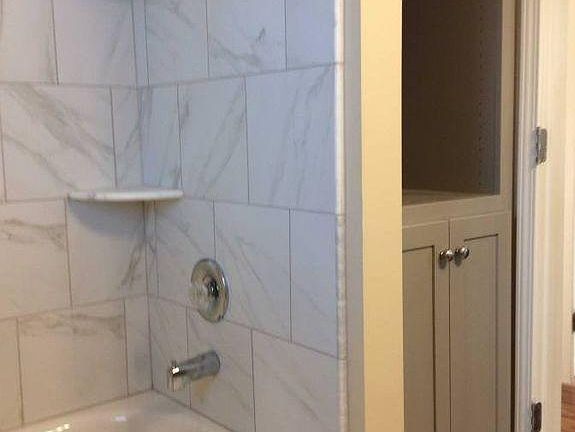 Bathroom w/custom bathroom storage cabinet