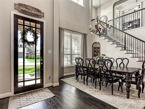Natural light flows into the space through the gorgeous front door, and the many windows that adorn the front of this home!