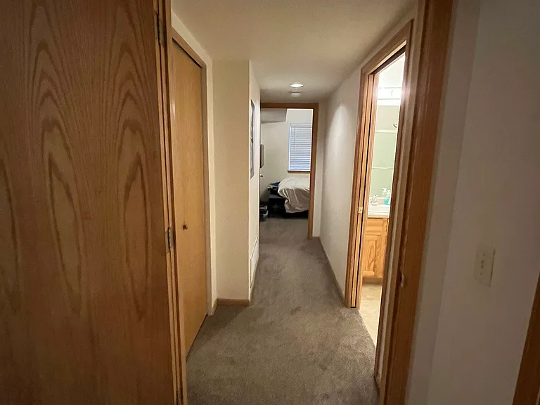 Looking down hallway from back bedroom toward livingroom