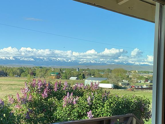 Spring snow capped Wallowa Mtns from front room windows NE view