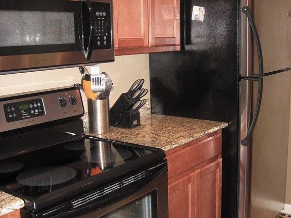 Kitchen, Stove and Refrigerator.