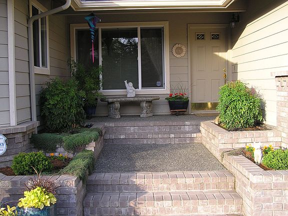 notice pots for flowers on the side of entry
