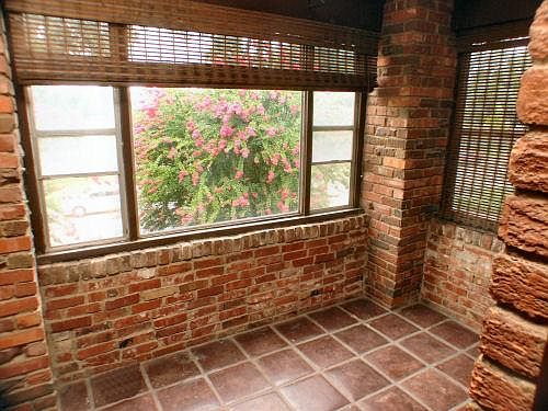 Sun Porch overlooking the River. Saltillo Tile, nice window coverings