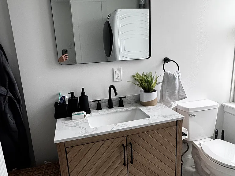 Enjoy a beautifully finished bathroom with premium fixtures, a dedicated heating element for added comfort, and a full-size residential washer and dryer.