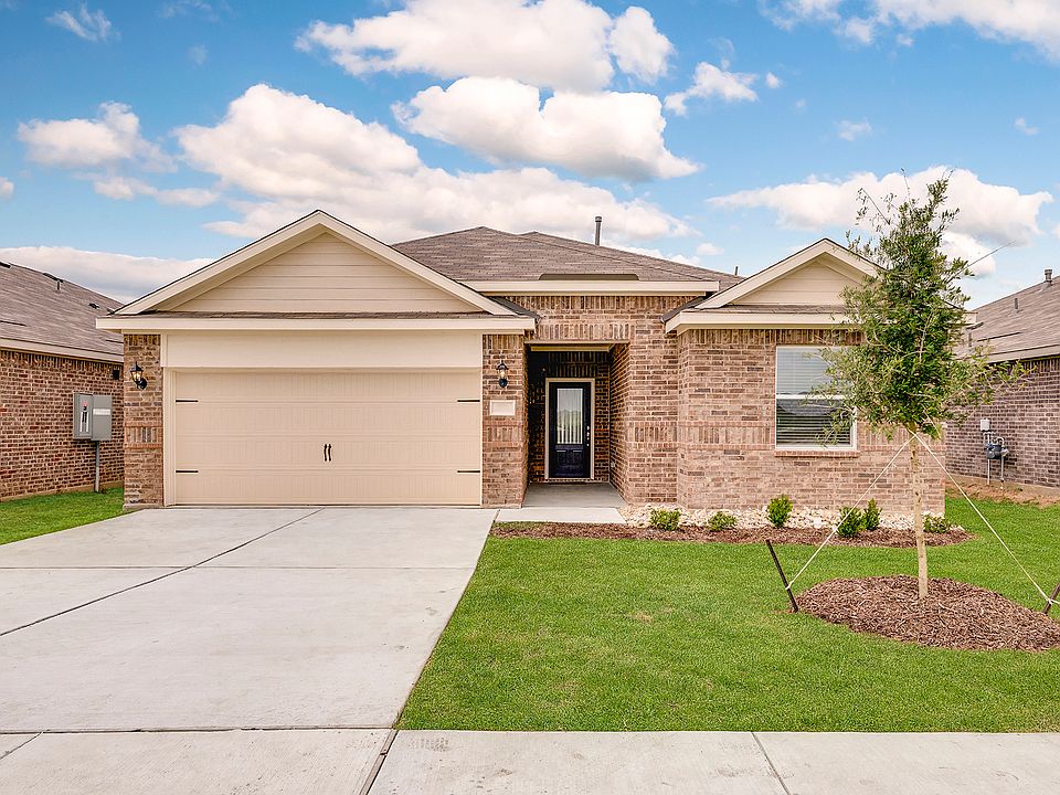 The Reed is a beautiful, one-story brick home.