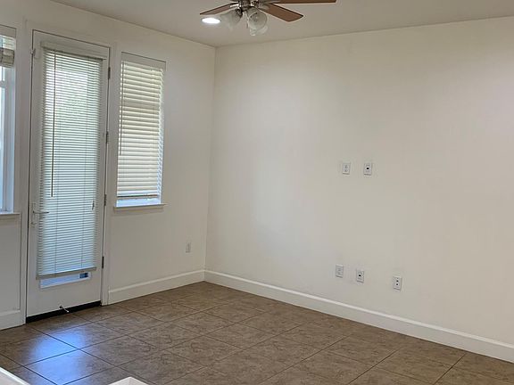 spacious living room with access to private patio
