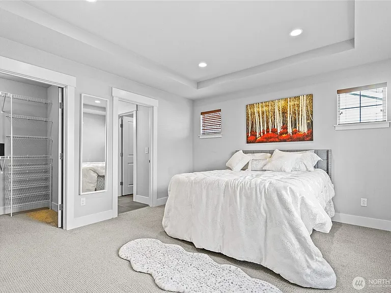 master bedroom with walk-in closet