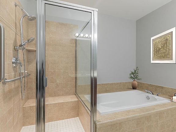 Primary Bath Features Dual-sink Vanity, Soaker Tub, and Large Shower