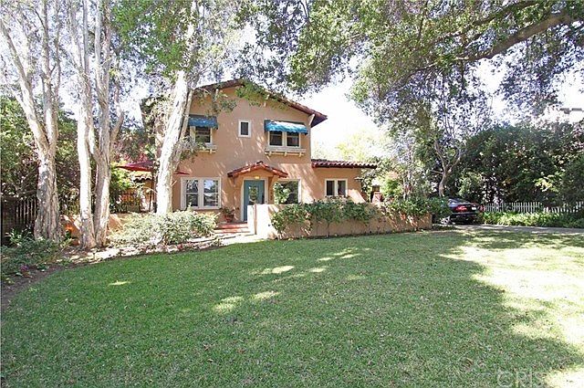 Storybook setting on tree-lined street, among pride of ownership residences in privileged San Marino