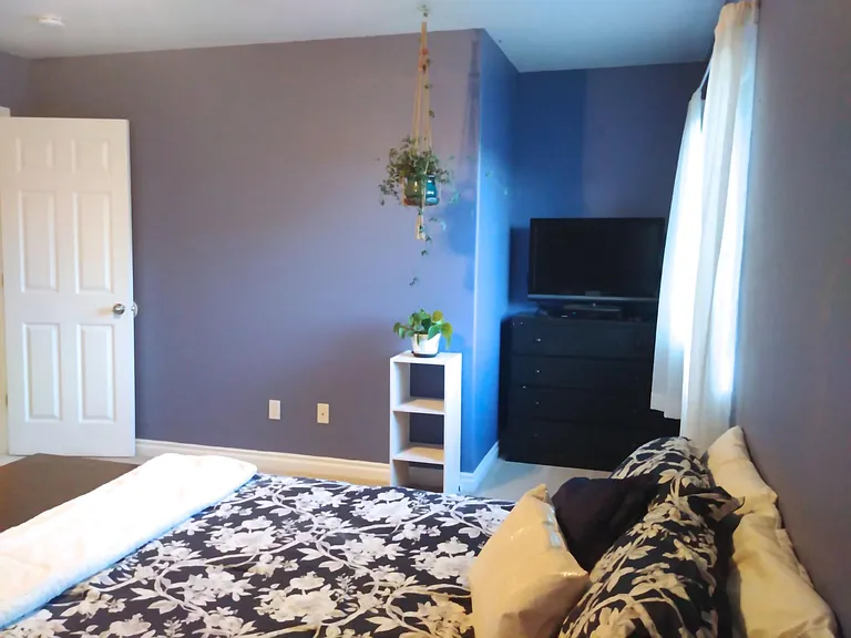 The master bedroom has been freshly painted an ivory color. Updated photo unavailable.