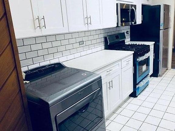 Brand new modern kitchen. All new appliances: refrigerator, gas stove, dishwasher, installed microwave, top load washer and dryer