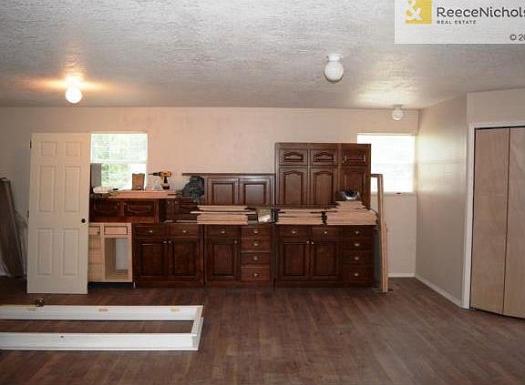 Uninstalled kitchen cabinets remain for room addition
