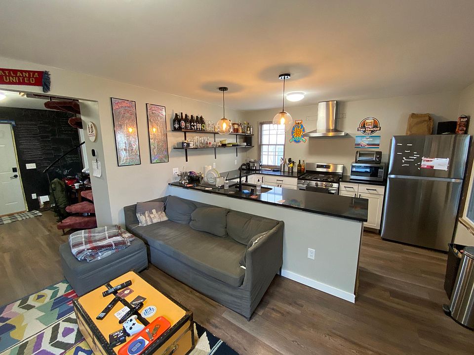 Open-concept kitchen and living room.