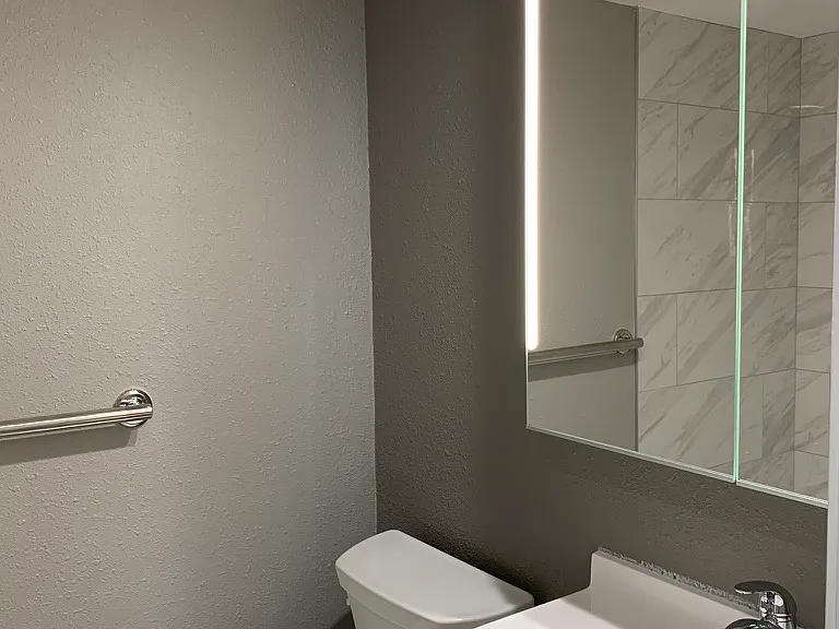 Make up lit mirror and vanity in bathroom