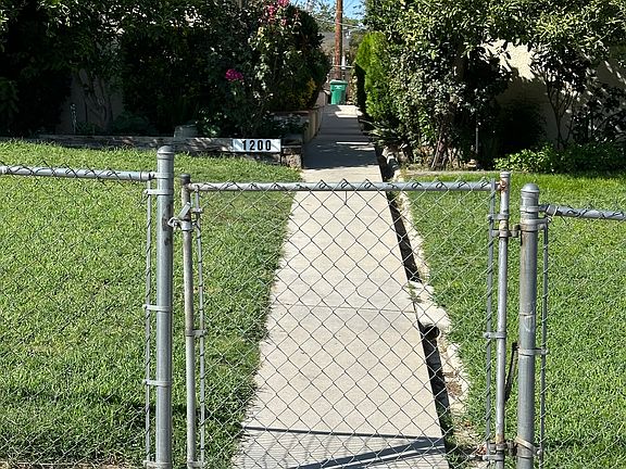 A security gate facing the beautiful garden and nature. Gardener on site.