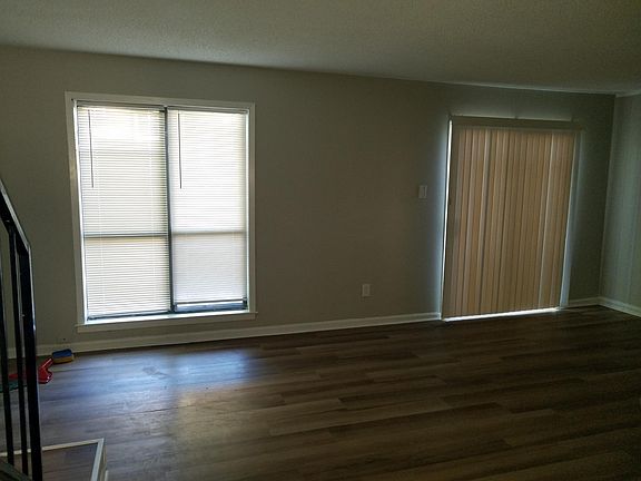 Great room/dining area with exist to fenced patio.