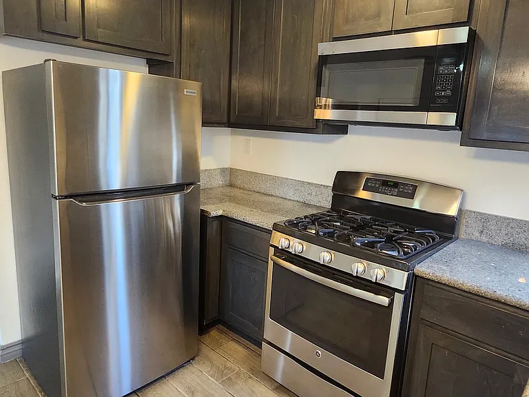 kitchen with refridgerator, stove and microwave included.