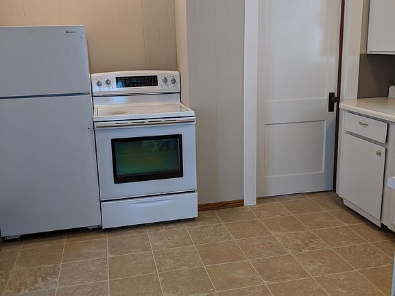 Kitchen with door to basement