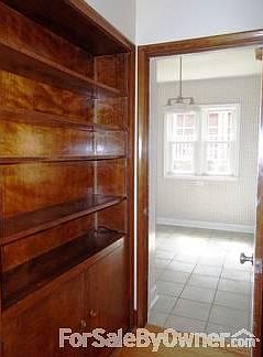 1st floor hallway
						:
						Built in bookcase and cabinet