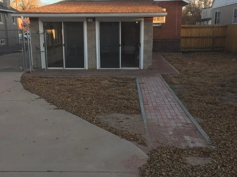 Rear enclosed sun room.