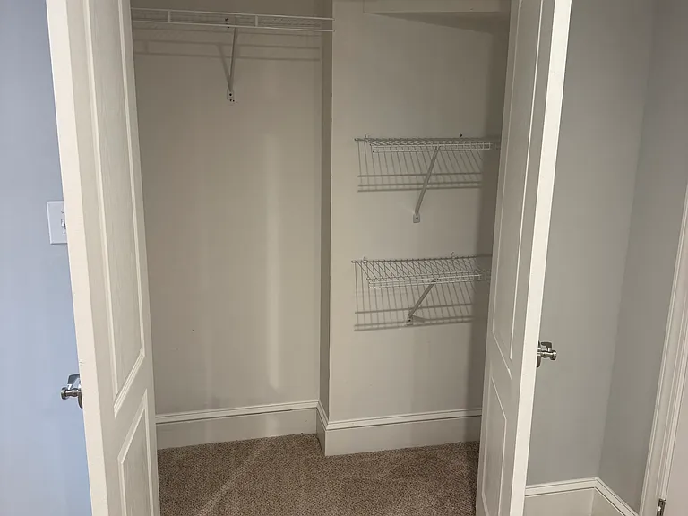 Extra closet in living room before laundry room