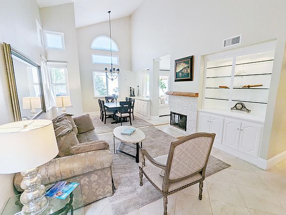 Living and Dining Room. Original photo. Currently tenant occupied with their furniture.