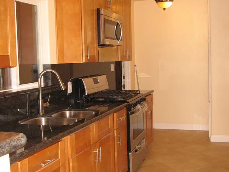Kitchen. Appliances included (microwave, stove and refrigerator.