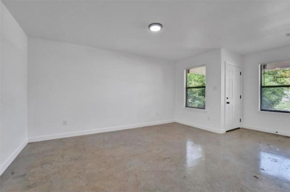 Spacious interior filled with natural light, complemented by freshly painted walls that create a clean and welcoming atmosphere.