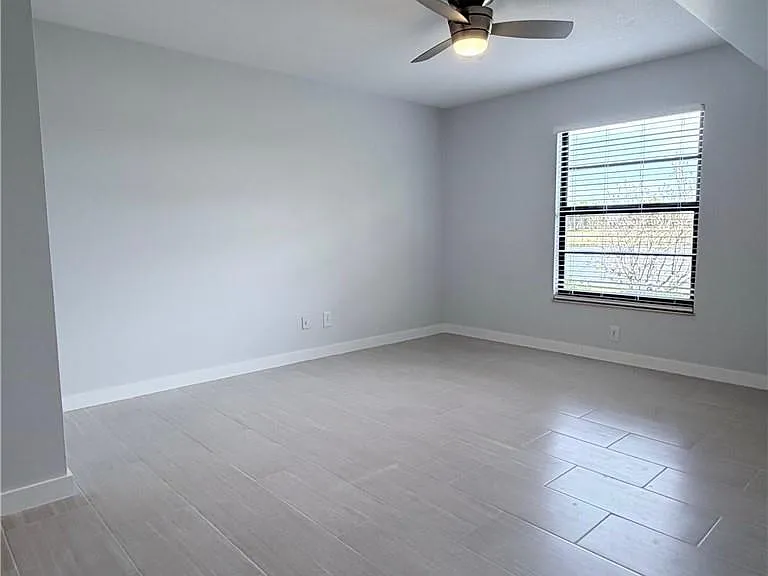 Entering the HUGE Bedroom w/ stunning lake & golf course views!