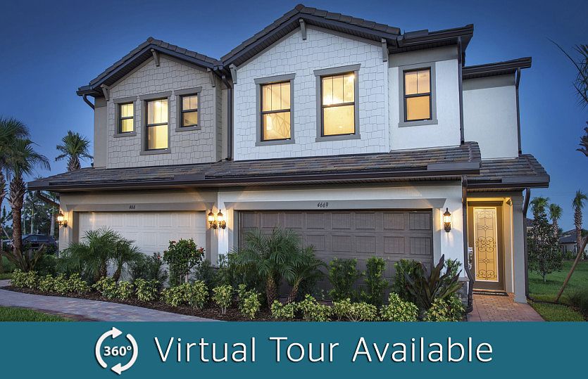 The Leland, a two-story town home with a 2 car garage, shown as the model Exterior at The Fields