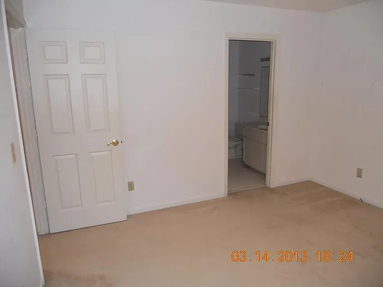 guest bedroom with private bathroom and closet