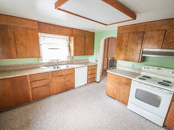 Kitchen (15x12) features newer counter tops and Maytag kitchen appliances including a bottom freezer refrigerator, electric self cleaning stove, automatic dishwasher and a disposal. 