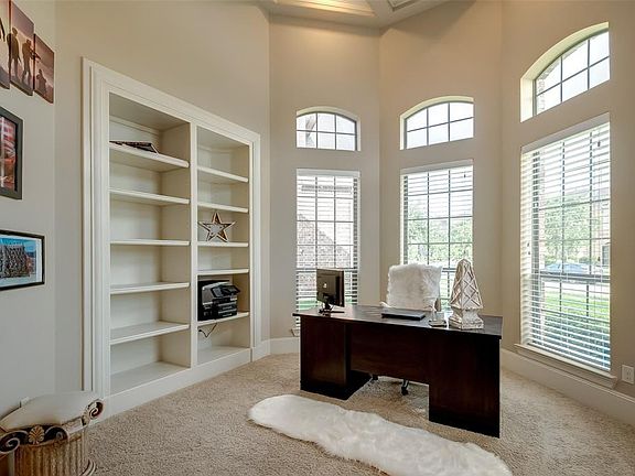 Private study is located just to the right of the entryway through the double French doors! Study features a wall of built- ins and bright sunny windows.