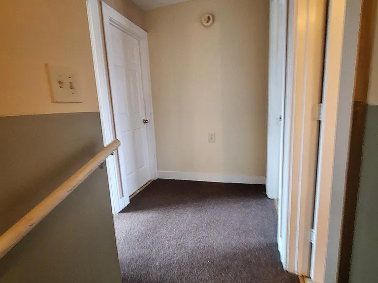 Hallway to bedrooms and bath