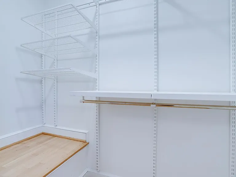 Elfa shelving in primary bedroom closet