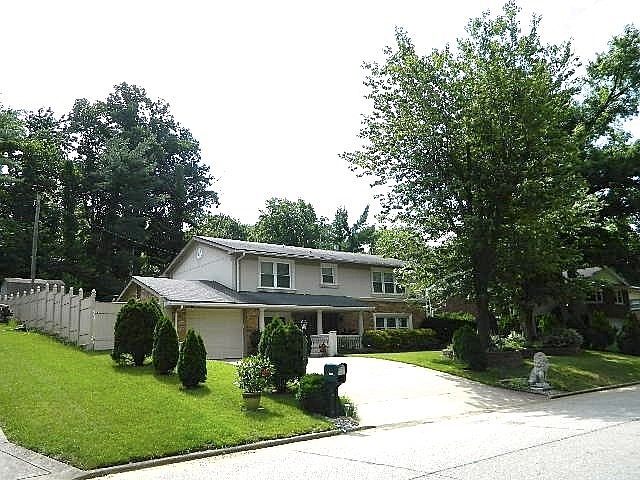 Nice fenced yard with above ground pool with deck and oversized patio.