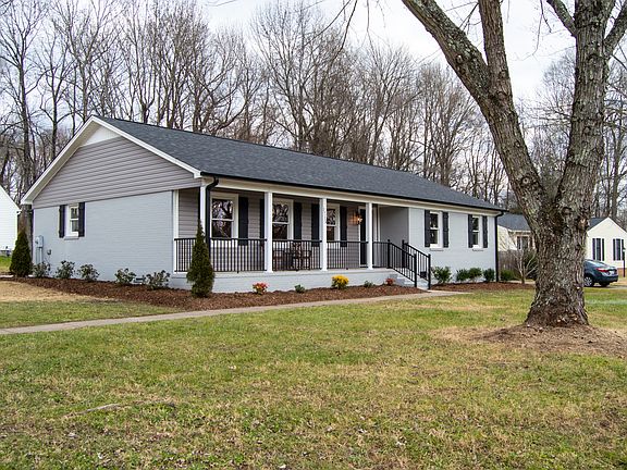 The corner lot provides are large front and side yard with mature trees